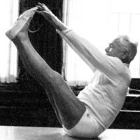 Joseph+Pilates,+the+visionary+behind+the+Pilates+method,+demonstrating+his+groundbreaking+techniques+for+mindful+movement+and+holistic+fitness_